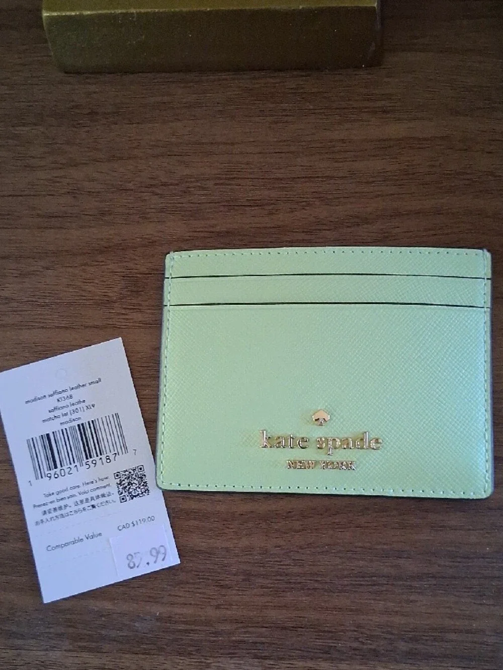 NWT Kate Spade mint green card case with gold logo